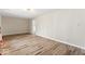 Large living room featuring hardwood floors, ample space, and neutral colors at 10129 Guilford Ave, Carmel, IN 46280