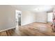 Open-concept living room with hardwood floors, neutral paint, and recessed lighting at 10129 Guilford Ave, Carmel, IN 46280