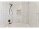 Close up of a modern shower with white subway tiles and a built-in niche at 10129 Guilford Ave, Carmel, IN 46280