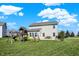 Large backyard featuring a play set with swings and slide at 10465 Long Branch Dr, Brownsburg, IN 46112