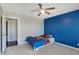 bedroom featuring blue accent wall and carpet at 10465 Long Branch Dr, Brownsburg, IN 46112