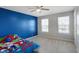 bedroom featuring a ceiling fan and two windows at 10465 Long Branch Dr, Brownsburg, IN 46112