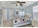 Bedroom with a ceiling fan, dresser with mirror and a window at 10465 Long Branch Dr, Brownsburg, IN 46112