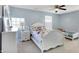 Bedroom with two beds, a ceiling fan and a dresser with a mirror at 10465 Long Branch Dr, Brownsburg, IN 46112
