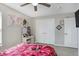 This bedroom features neutral walls, a closet, ceiling fan, and decor at 10465 Long Branch Dr, Brownsburg, IN 46112
