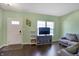 Cozy living room featuring wood floors, lots of natural light and a comfortable seating area at 10465 Long Branch Dr, Brownsburg, IN 46112