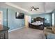 Main bedroom with ensuite and a ceiling fan and carpet at 10465 Long Branch Dr, Brownsburg, IN 46112