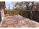 Backyard featuring a wooden deck, partial fence, lush trees, and exterior AC unit at 1121 Canterbury Ct, Indianapolis, IN 46260