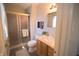 Bathroom with a new vanity, enclosed glass shower and neutral tile flooring at 1121 Canterbury Ct, Indianapolis, IN 46260