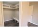 This walk-in closet offers a shelf for shoes, storage, and is conveniently located next to a door at 1121 Canterbury Ct, Indianapolis, IN 46260