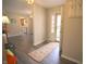 Welcoming entryway with gray flooring and a view into the kitchen at 1121 Canterbury Ct, Indianapolis, IN 46260