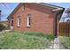 Well-maintained brick house exterior featuring neat landscaping and fenced backyard at 1121 Canterbury Ct, Indianapolis, IN 46260