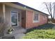 Charming brick home with a welcoming front door and lovely landscaping at 1121 Canterbury Ct, Indianapolis, IN 46260
