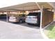 Exterior view of the reserved carport parking featuring two parked vehicles at 1121 Canterbury Ct, Indianapolis, IN 46260