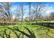 This property boasts a serene backyard view with a pond and a fenced perimeter, providing a peaceful retreat at 11249 Tall Trees Dr, Fishers, IN 46038