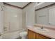 Bathroom with a combination shower and tub, featuring a vanity and mirror for added functionality and convenience at 11249 Tall Trees Dr, Fishers, IN 46038