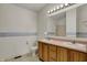 Bathroom with a double vanity and a large mirror creating a bright and functional space at 11249 Tall Trees Dr, Fishers, IN 46038