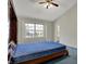 Well-lit bedroom featuring vaulted ceilings and large window, creating a bright atmosphere at 11249 Tall Trees Dr, Fishers, IN 46038