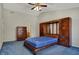 Bedroom with vaulted ceiling, fan, and built-in cabinetry, offering ample storage space at 11249 Tall Trees Dr, Fishers, IN 46038