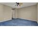 Inviting bedroom featuring neutral paint, soft blue carpet, and vibrant ceiling fan for added comfort and charm at 11249 Tall Trees Dr, Fishers, IN 46038
