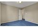 Inviting bedroom with neutral paint, plush blue carpet, and ample natural light, creating a serene retreat at 11249 Tall Trees Dr, Fishers, IN 46038