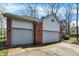 Spacious three-car garage featuring brick and siding with ample parking and storage space at 11249 Tall Trees Dr, Fishers, IN 46038