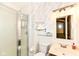 Bathroom featuring a glass shower, toilet, sink and vanity, decorative wallpaper, and mirror at 1153 Diablo Rd, Greenwood, IN 46143
