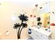 Bright bathroom featuring a vanity, mirror, and tropical-themed decor at 1153 Diablo Rd, Greenwood, IN 46143