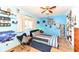 Blue bedroom with vinyl floors, decorated with unique fixtures, bright decor, and ceiling fan at 1153 Diablo Rd, Greenwood, IN 46143