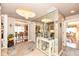 Spacious foyer with a chandelier, decorative mirror, console table and view of dining area at 1153 Diablo Rd, Greenwood, IN 46143