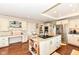 Bright kitchen featuring an island with granite countertops, wine rack and stainless steel appliances at 1153 Diablo Rd, Greenwood, IN 46143