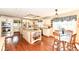 Well-lit kitchen featuring stainless steel appliances, granite countertops, and a dining area at 1153 Diablo Rd, Greenwood, IN 46143