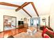Bright living room with hardwood floors, vaulted ceiling with wood beams, and dining area at 1153 Diablo Rd, Greenwood, IN 46143