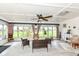 Bright and airy sunroom with ample seating, large windows, and views of the lush backyard at 1153 Diablo Rd, Greenwood, IN 46143