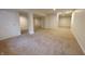Large finished basement with columns and neutral carpeting, providing ample space at 12332 Cobblefield Ct, Fishers, IN 46037