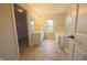 Primary bathroom with double sink vanity, corner tub, and glass shower enclosure at 12332 Cobblefield Ct, Fishers, IN 46037