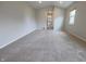 Neutral colored carpet, white paint, and one window in the upstairs bedroom at 12332 Cobblefield Ct, Fishers, IN 46037