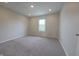 Bedroom with neutral carpeting, a window offering natural light, and modern recessed lighting at 12332 Cobblefield Ct, Fishers, IN 46037