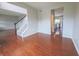 Spacious living room featuring hardwood floors and a staircase at 12332 Cobblefield Ct, Fishers, IN 46037