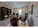Office with modern desk, shelving, a comfortable black chair, and bright lighting at 12332 Cobblefield Ct, Fishers, IN 46037