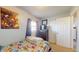 Bright bedroom with a single bed, closet and cartoon wall art at 126 Windemere Rd, Whiteland, IN 46184