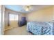 Simple bedroom featuring a ceiling fan, dresser, and a comfortable bed at 126 Windemere Rd, Whiteland, IN 46184