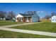 Charming brick home featuring a well-manicured lawn, driveway and side yard at 126 Windemere Rd, Whiteland, IN 46184