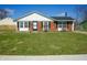 Charming brick home featuring a well-manicured lawn and traditional architecture at 126 Windemere Rd, Whiteland, IN 46184