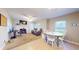 Open-concept living space with a fireplace and combined seating and dining area at 126 Windemere Rd, Whiteland, IN 46184