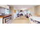 Bright kitchen, dining and living area with stainless appliances and fireplace at 126 Windemere Rd, Whiteland, IN 46184