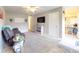 Inviting living room with neutral tones, plush carpet, and a comfortable sofa at 126 Windemere Rd, Whiteland, IN 46184
