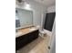 The primary bathroom features double sinks, granite countertops, and a shower-tub combination at 1272 Southlake E Ave, Greenwood, IN 46143