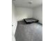 A bedroom features neutral gray carpeting, white walls, and ample space for customization at 1272 Southlake E Ave, Greenwood, IN 46143