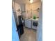 Well-equipped laundry room with appliances, shelving, and ample space for cleaning essentials at 1272 Southlake E Ave, Greenwood, IN 46143